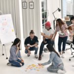 Group of business persons brainstorming and preparing for a presentation